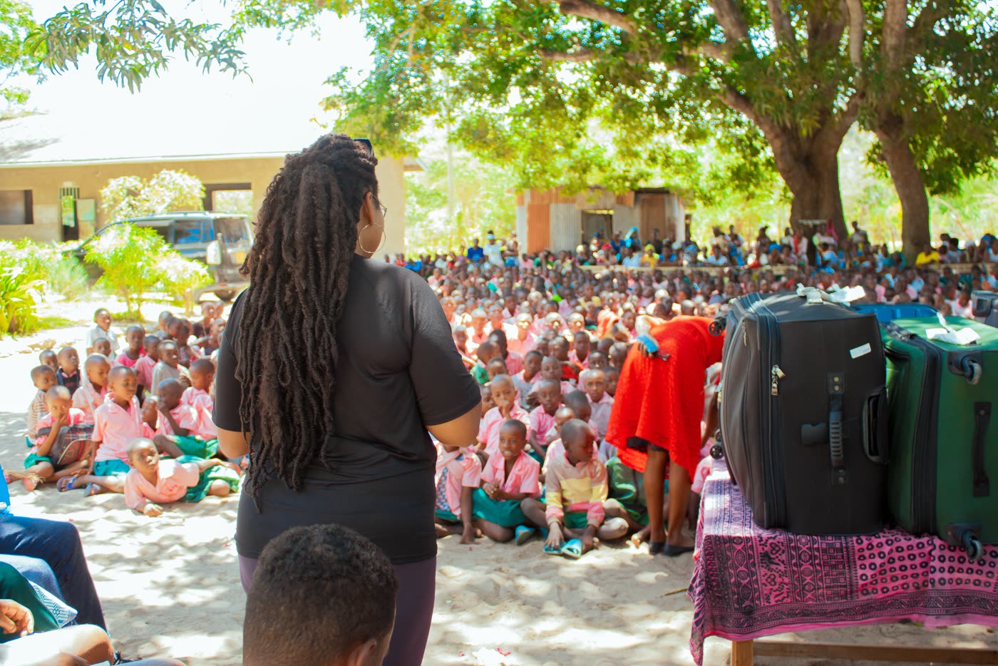 Hundreds of students gathered under the trees at Mijomboni Primary