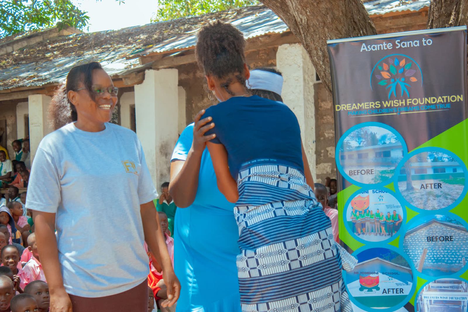 Community members and volunteers at a school handover