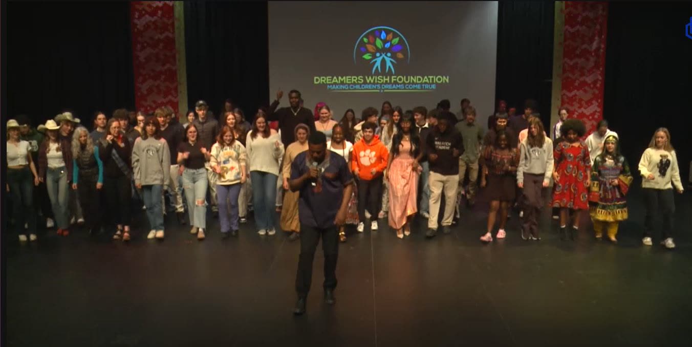 Dancers and families on stage at a Dreamers Wish Foundation showcase