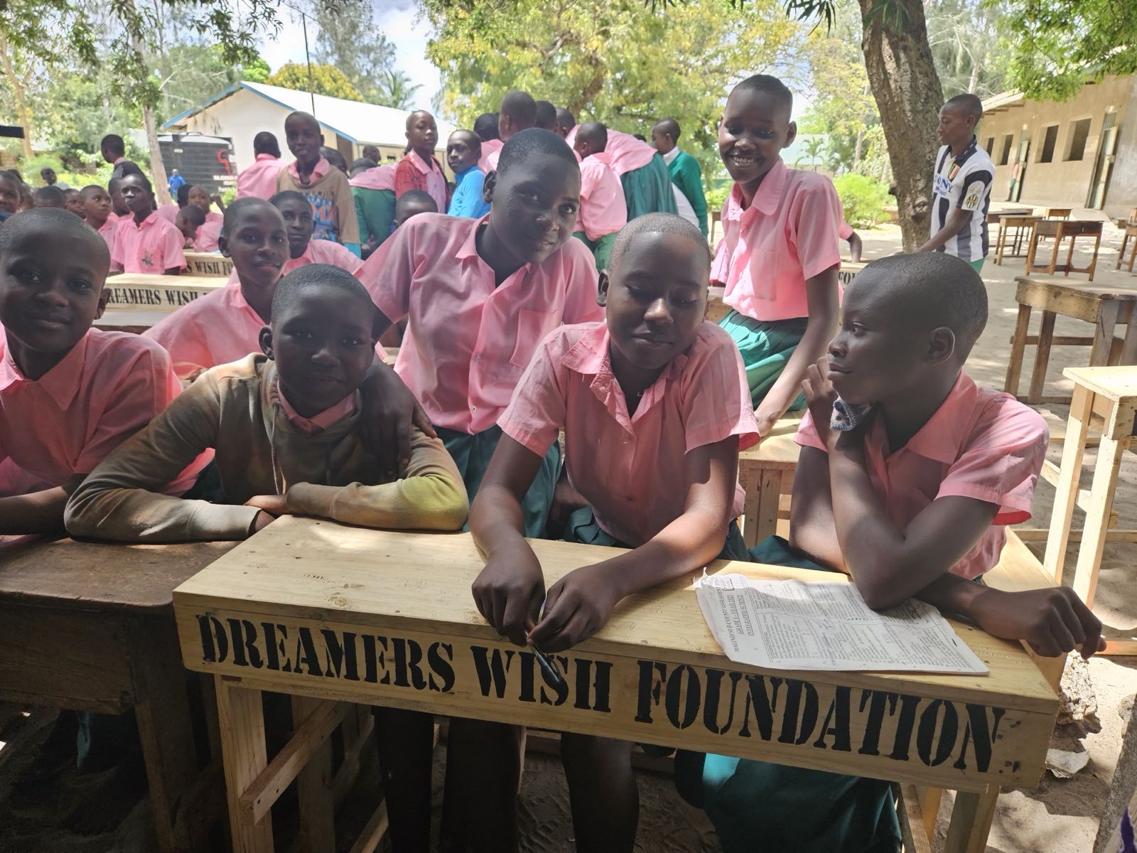 Students at Mijomboni Primary School in Kenya at their new Dreamers Wish Foundation desks